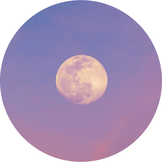 A large, full moon glowing softly against a serene, pastel purple and pink sky.